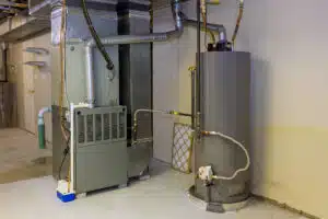 Conventional tank water heater and HVAC equipment in a mechanical room