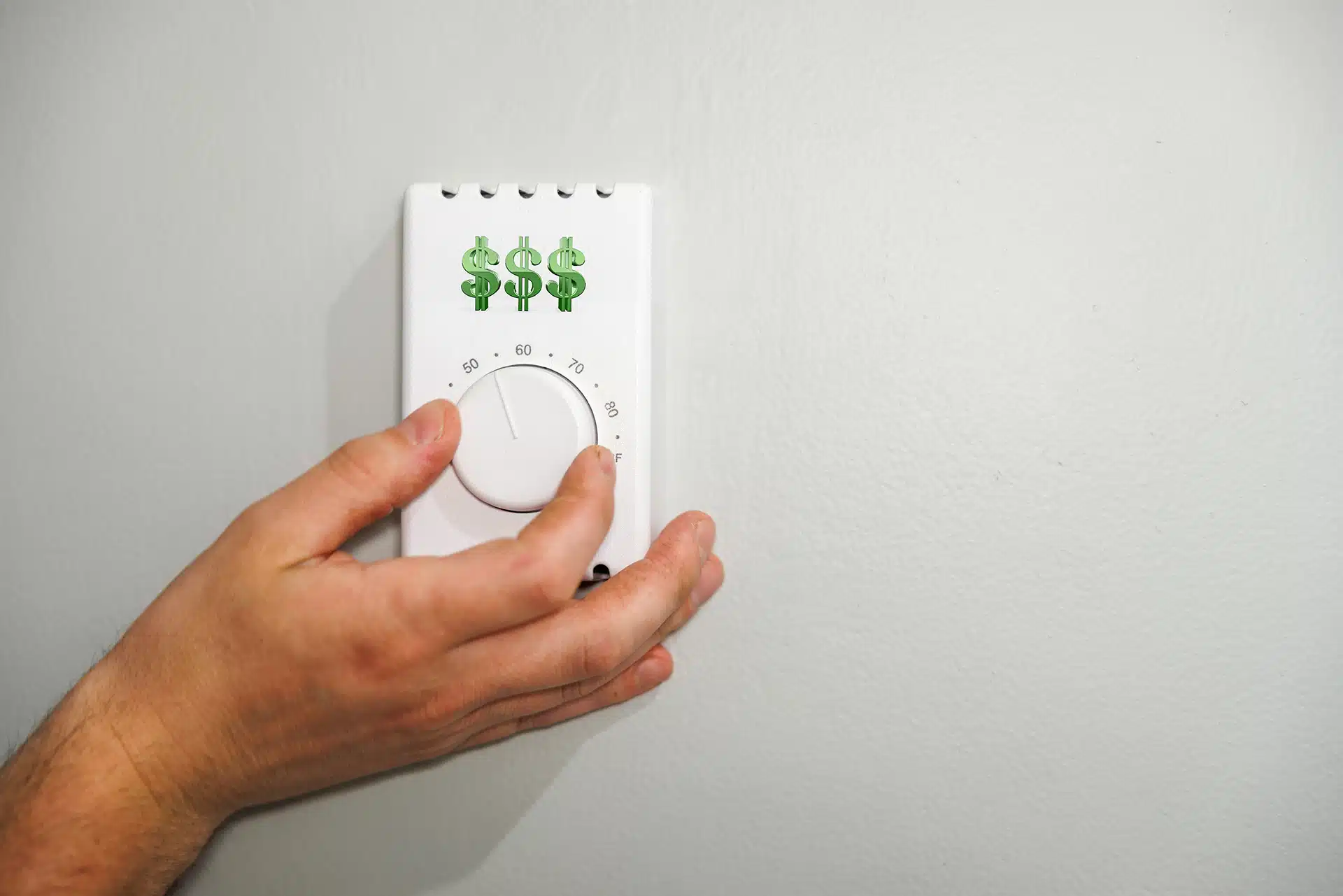 Homeowner adjusting a thermostat while checking hot water performance