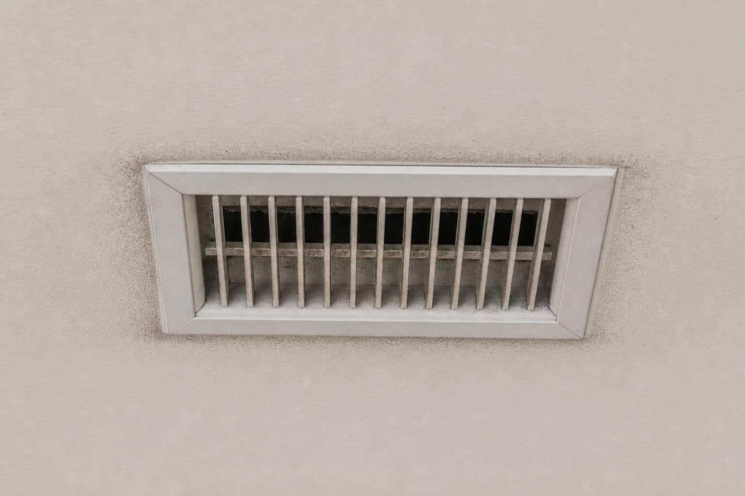Ceiling register with visible dust staining around the grille perimeter from air bypassing the duct boot