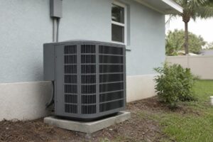 Outdoor heat pump beside a Florida home